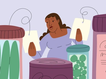 Woman of Color Compares Price Tags at Grocery Store During Economic Inflation
