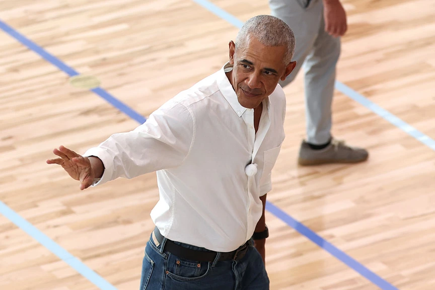 Barack Obama waves to players at the OPC.