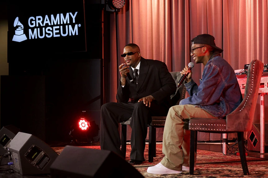 YG speaks with Frazier Tharpe onstage at the Grammy Museum.