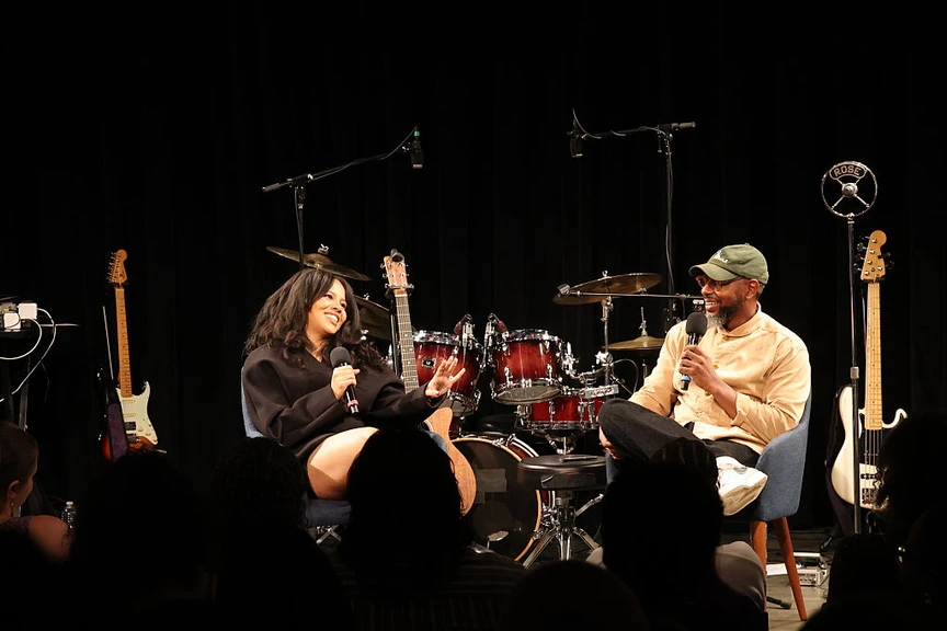 Baby Rose talks with moderator Marcus J. Moore.