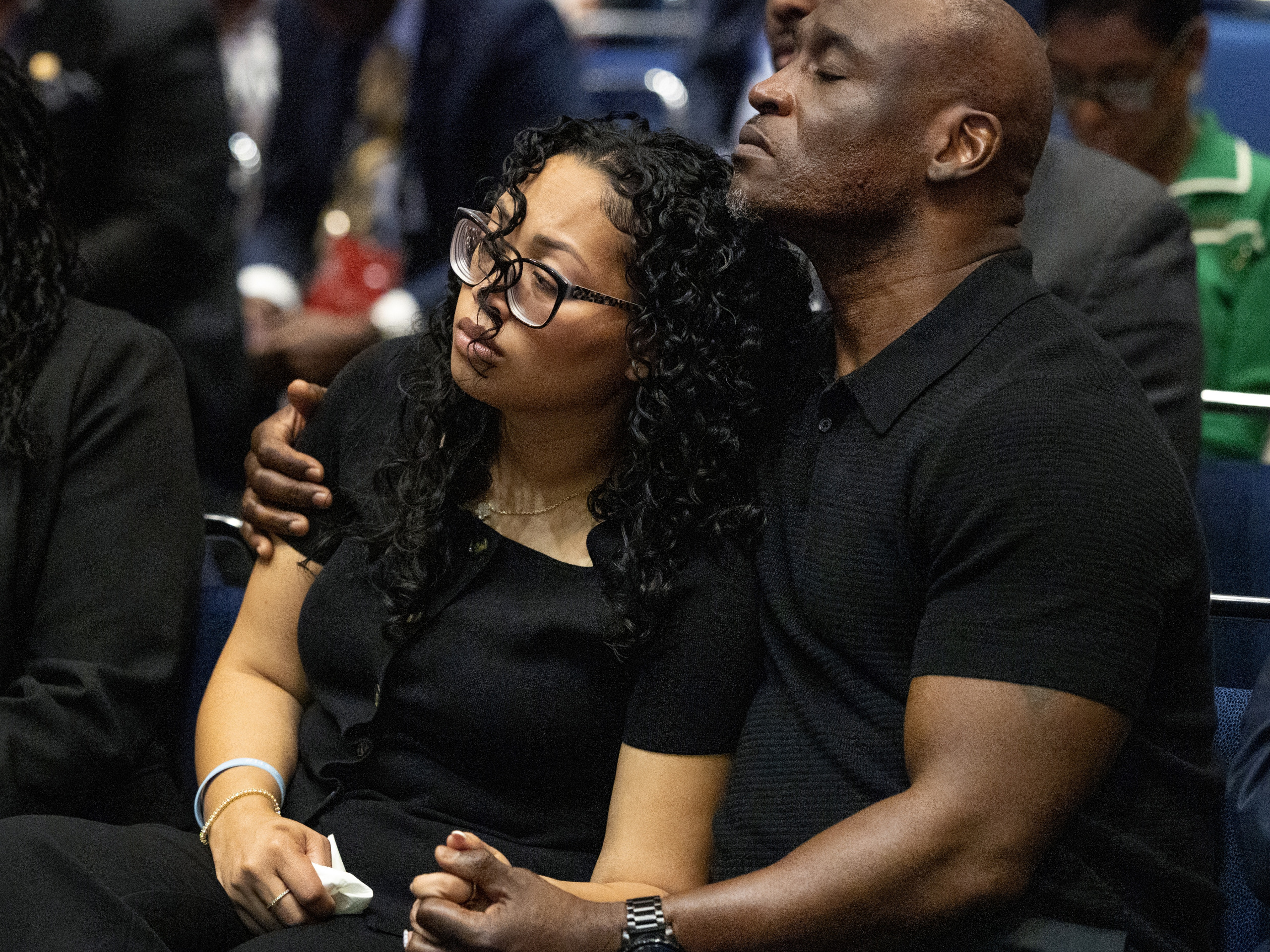 Christine and Elmore lean on each other as they live through an extraordinary pain. (Photo by Scott Olson/Getty Images)