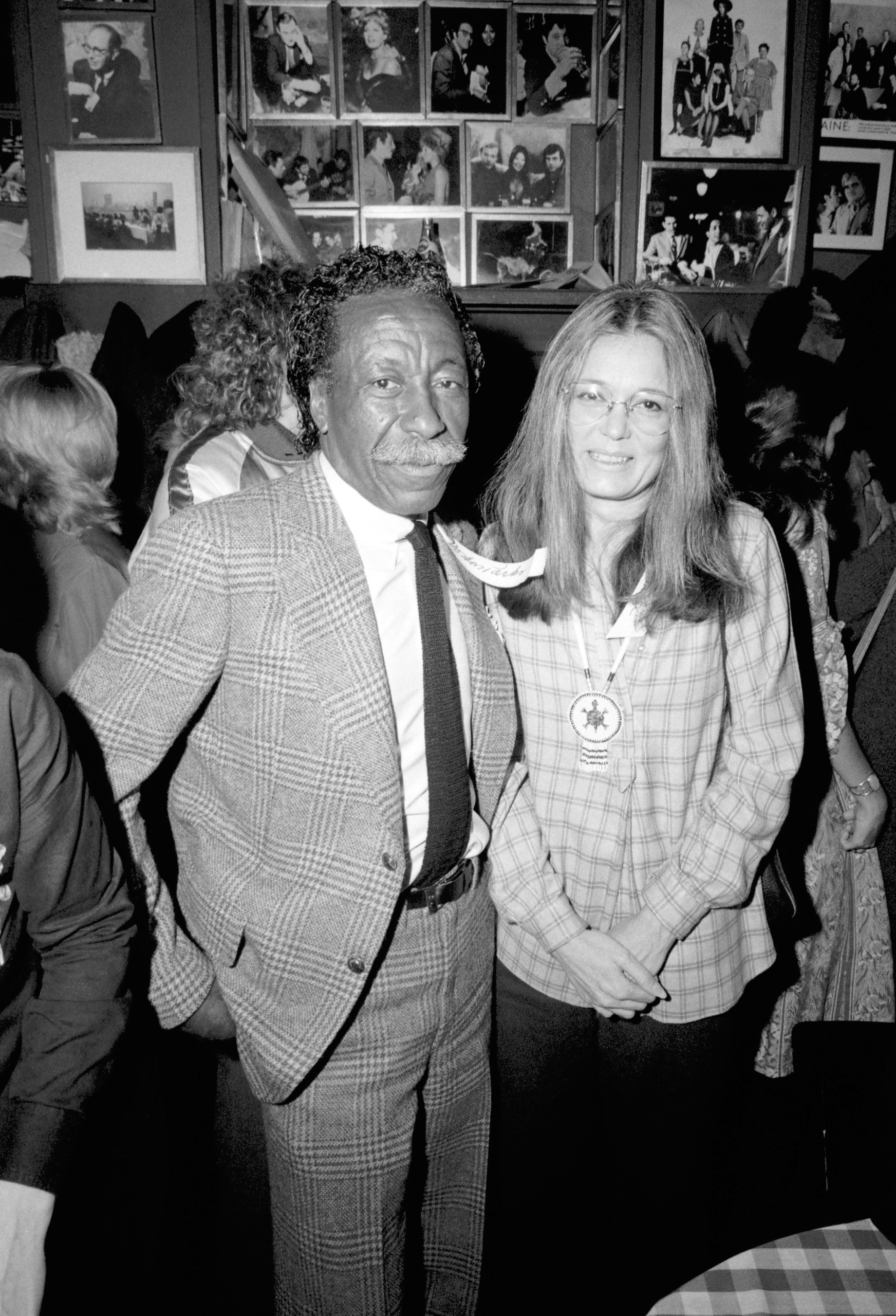 Groundbreaking photographer Gordon Parks and Gloria Steinem during the Equal Rights Amendment (ERA) party in New York City on April 17, 1978. (Photo by Oscar Abolafia/TPLP/Getty Images)