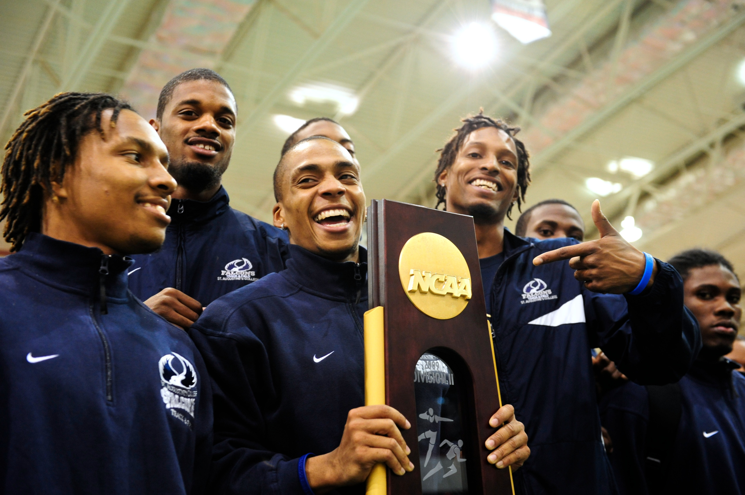 St. Augustine men's team celebrate their first place finish during an Indoor Track and Field Championship Competition in 2009. SAU had one of the most dominant and historic NCAA track and field programs in college sports history. (Photo credit: Getty Images)