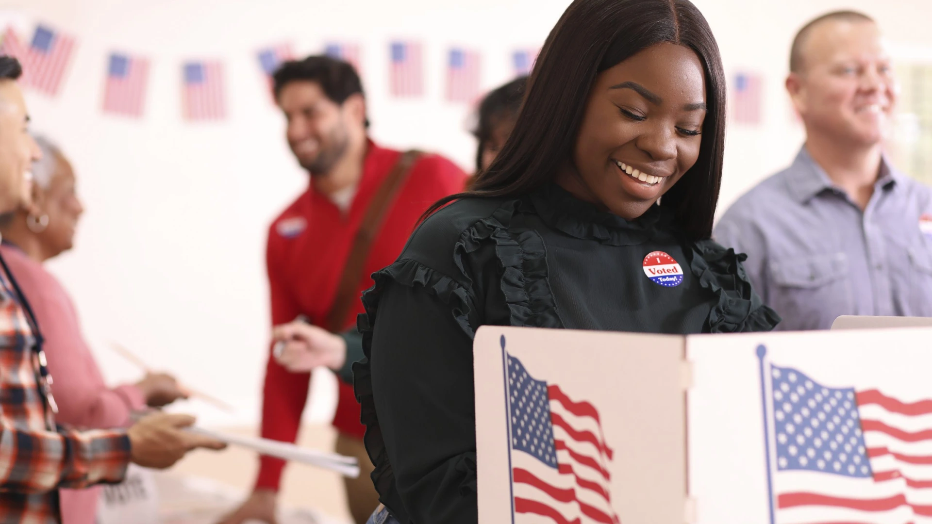 Mid-adult, African descent woman votes in USA election.