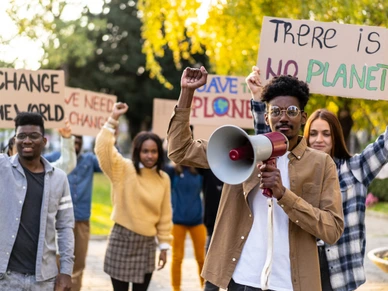 Climate change protestors hold their placards high