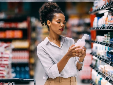 A Serious Beautiful Cuban Woman Shopping At The Supermarket