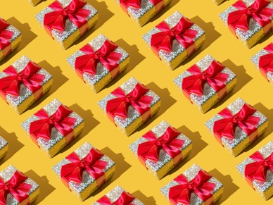 Repeated silver gift box on the yellow background