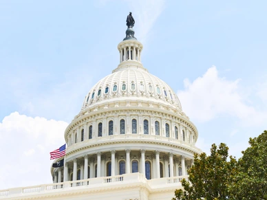 United States Capitol Building Dome with American Flag waving