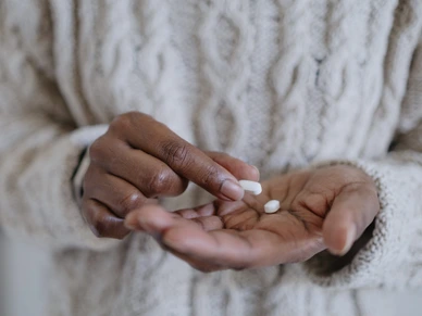 Woman Holds Pills