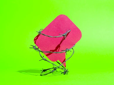 Freedom of speech – speech bubble behind barbed wire